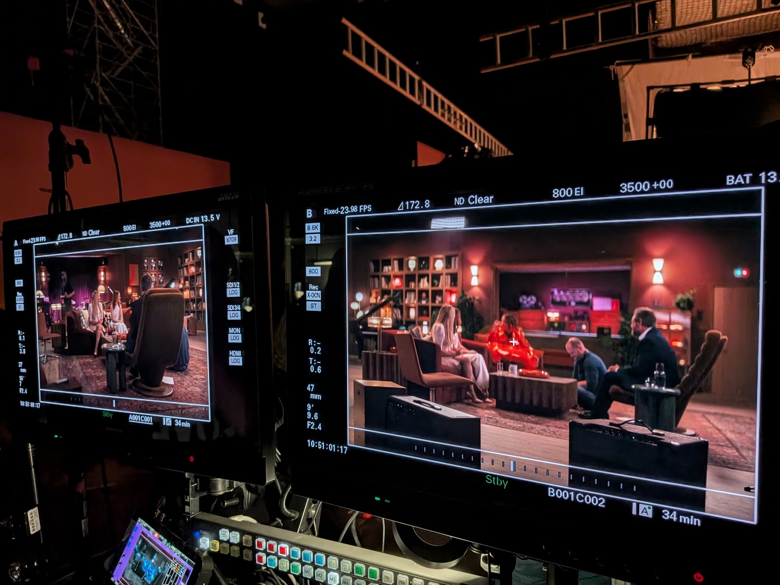 Two production monitors display shots of the Spice Girls and Pumpkin Spice on the recording-studio set.