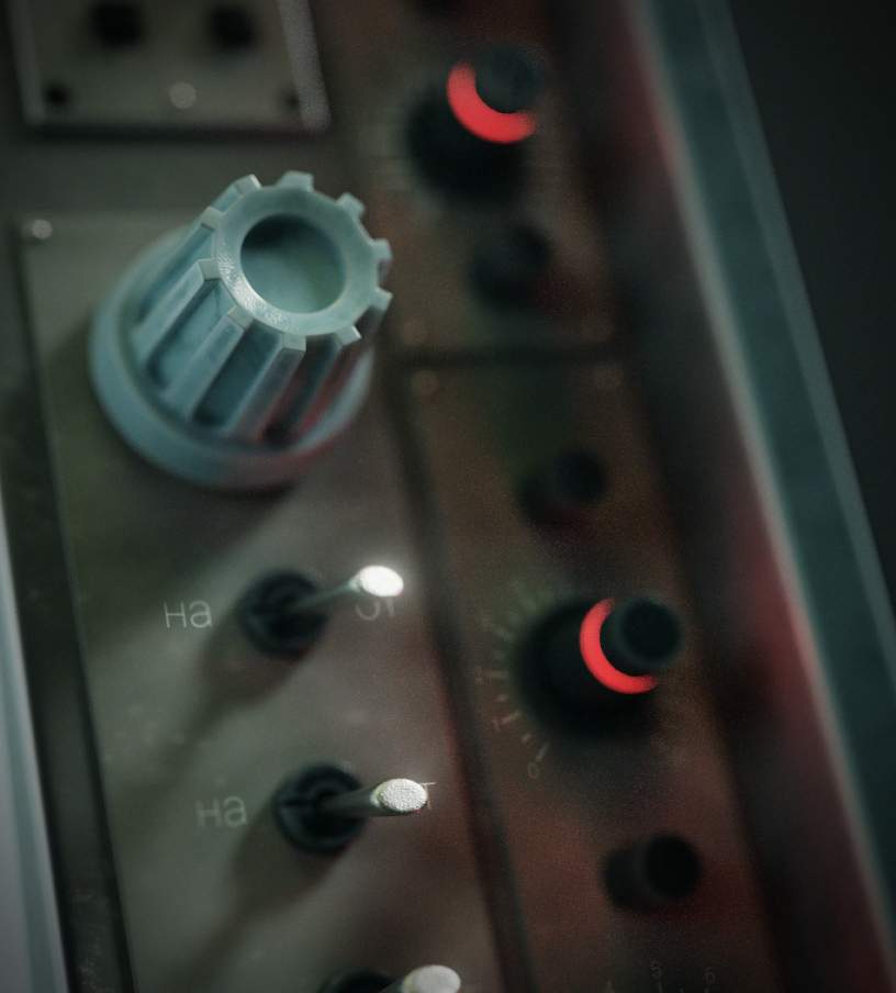 Close-up of knobs on a retro electronic device.