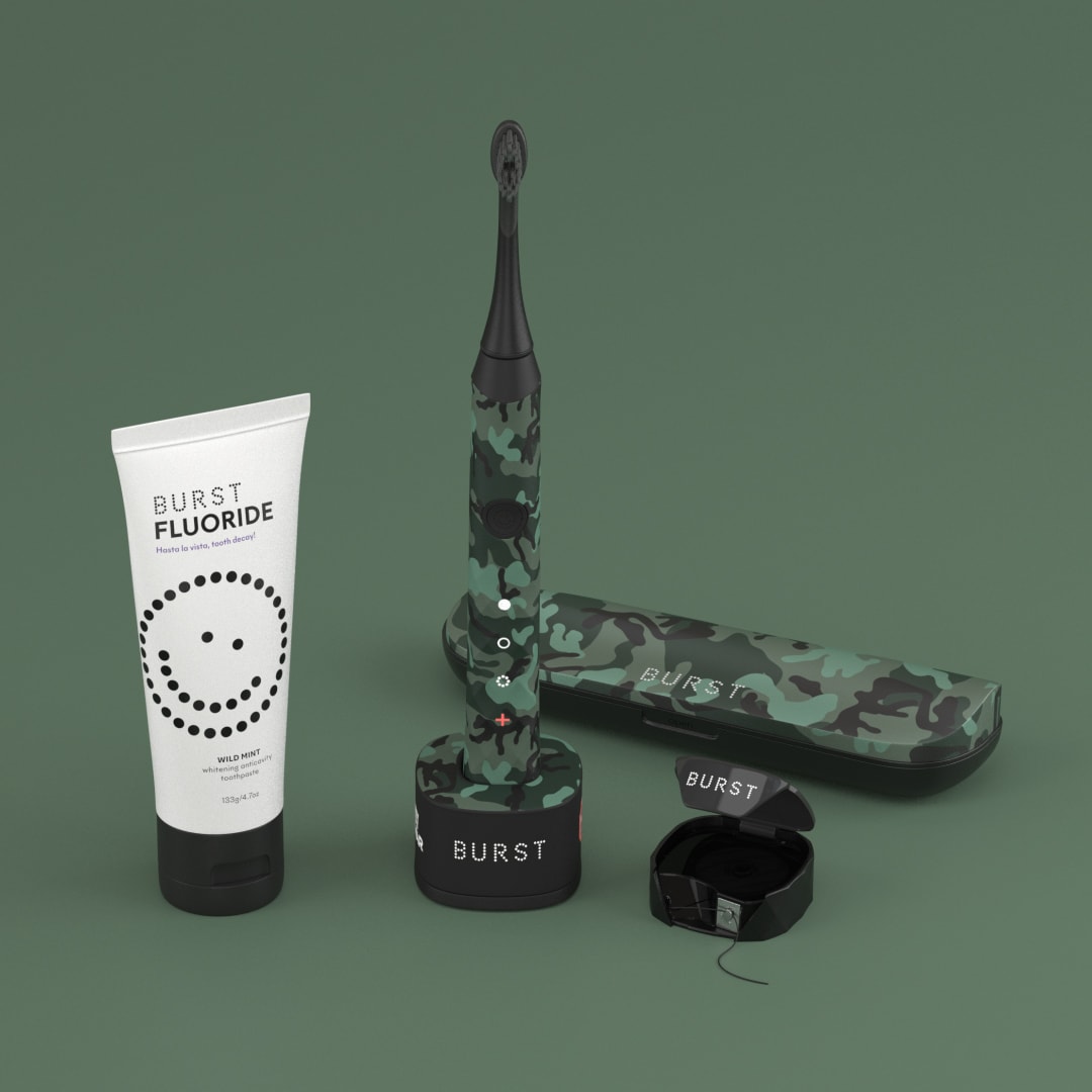 Camouflage Burst oral-care products arranged against a muted green background.