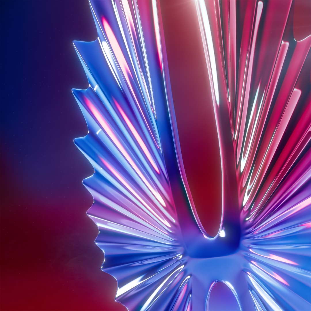 Close-up of the statuette’s radiating chrome blades reflecting pink and blue light.