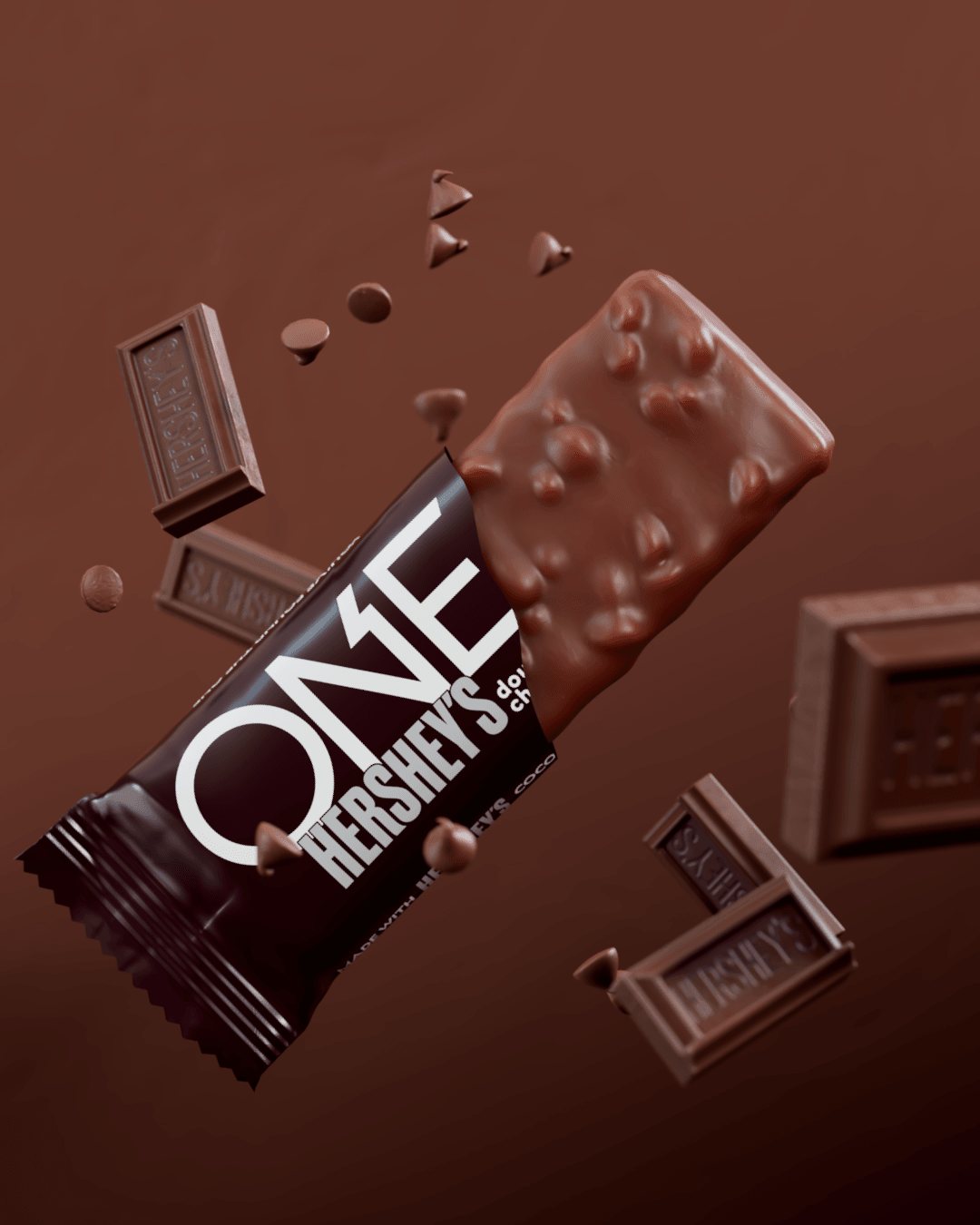 ONE Hershey’s protein bar with chocolate pieces on a brown background.
