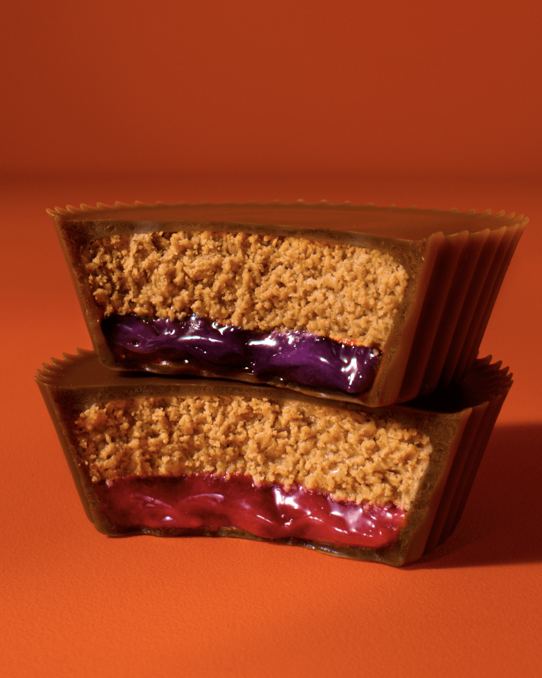 Stacked Reese’s PB&J cups reveal grape and strawberry fillings.