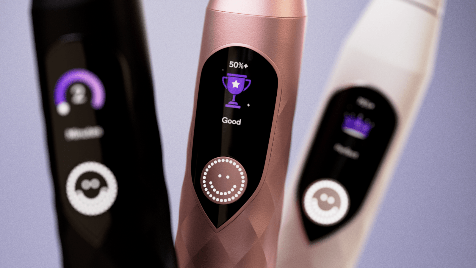 Three Burst Pro toothbrushes display their illuminated screens.
