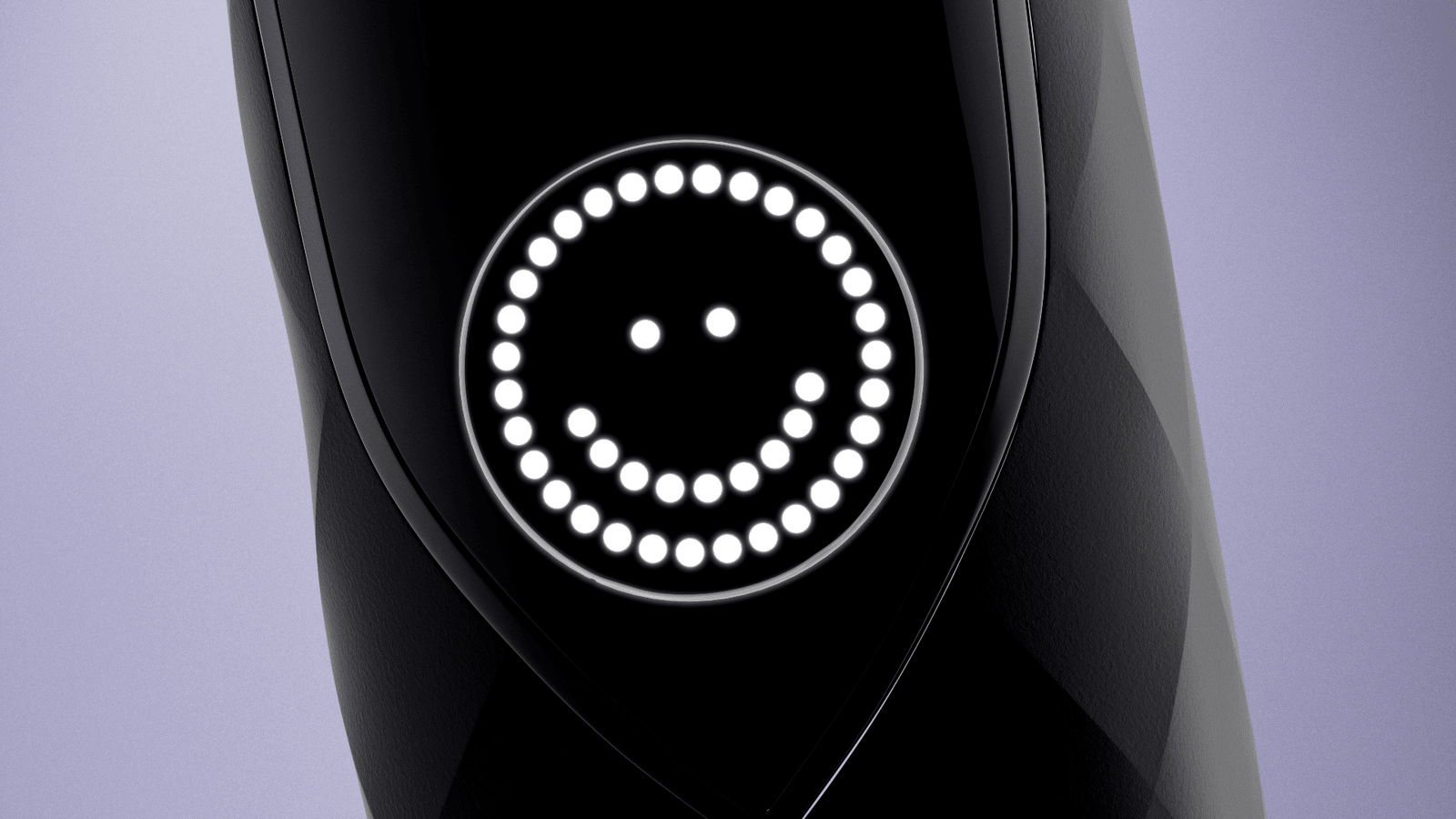 A smiling dotted face lights up the screen of a black Burst Pro toothbrush.