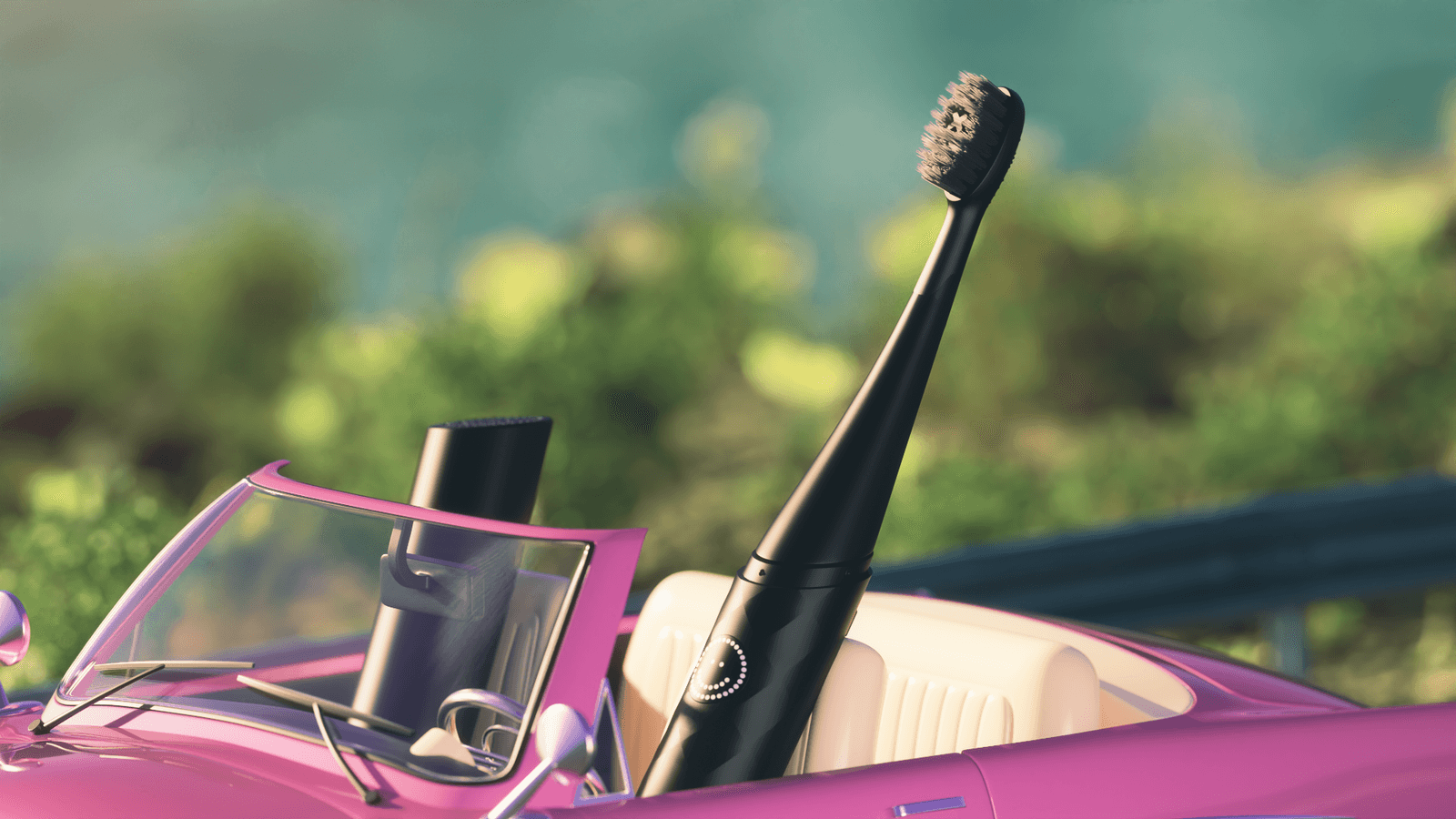 A black Burst Curve toothbrush rides in a pink convertible.