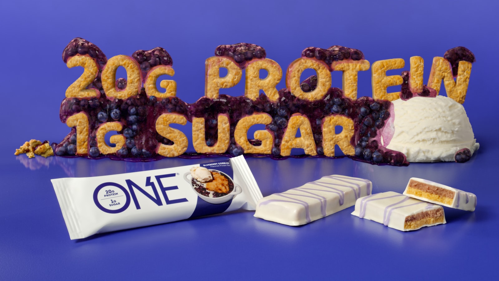 Blueberry crumble typography spelling “20g protein, 1g sugar” above a ONE bar.