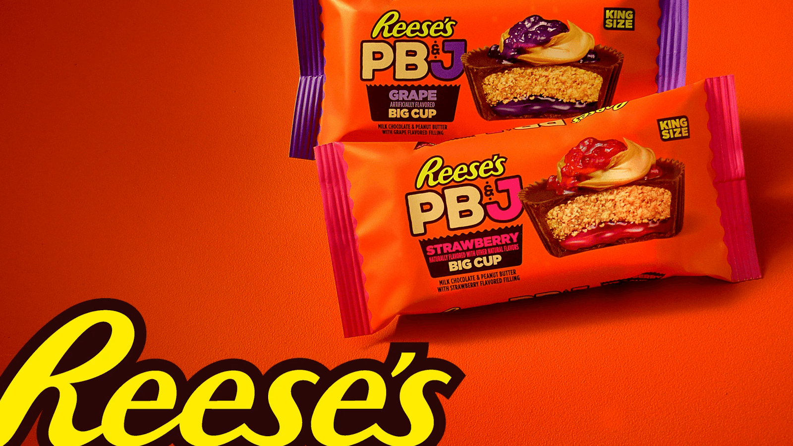 Reese’s PB&J grape and strawberry packages on an orange background.