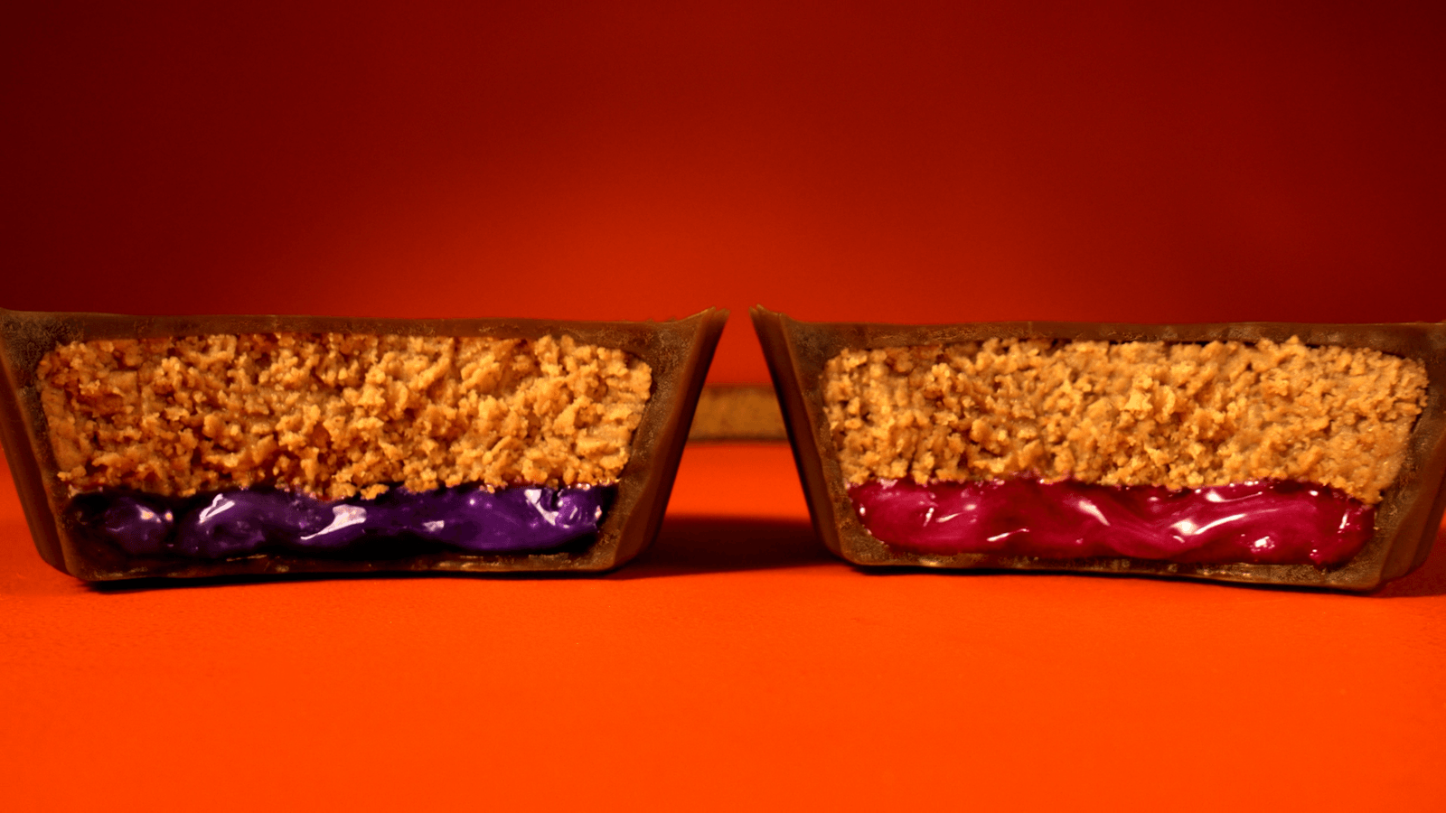 Cutaway views of Reese’s cups with grape and strawberry filling.