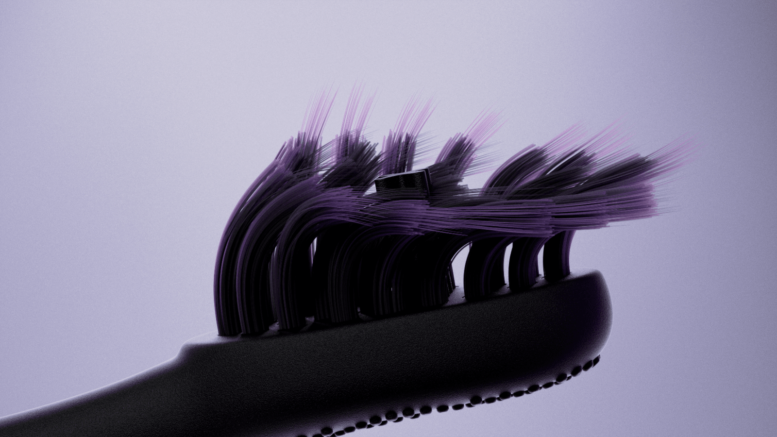 Close-up of black Burst Pro bristles against a lavender background.