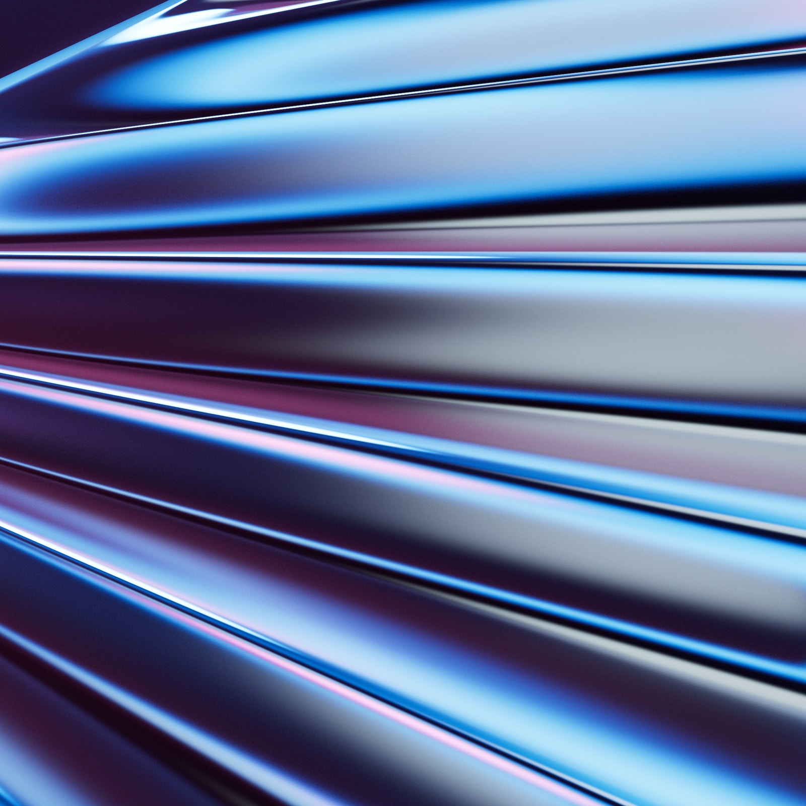 Diagonal chrome ridges reflecting cyan and magenta light.